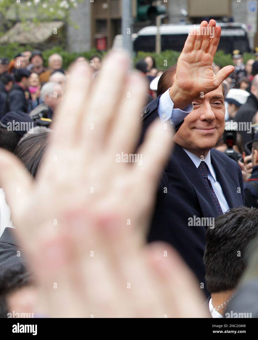 Italian Premier Silvio Berlusconi Gestures As He Leaves The Tribunal In